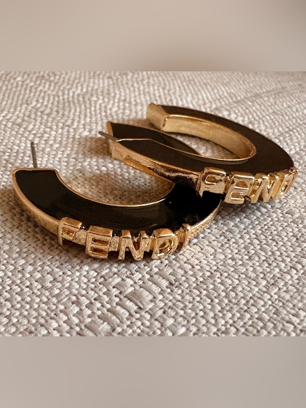 Fendi Black Resin Hoops with Gold Logo Accents